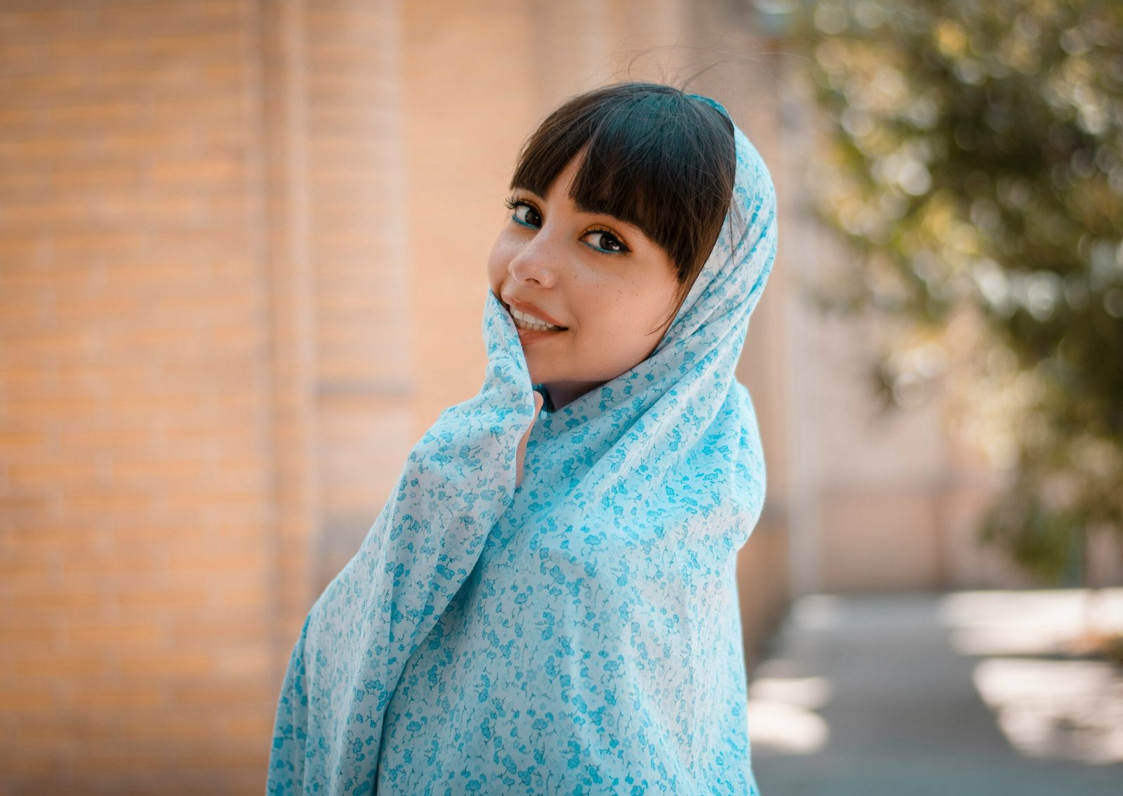 girl in blue hoodie standing